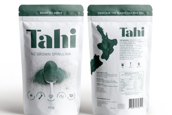 Pouches of Tahi Spirulina powderon white background