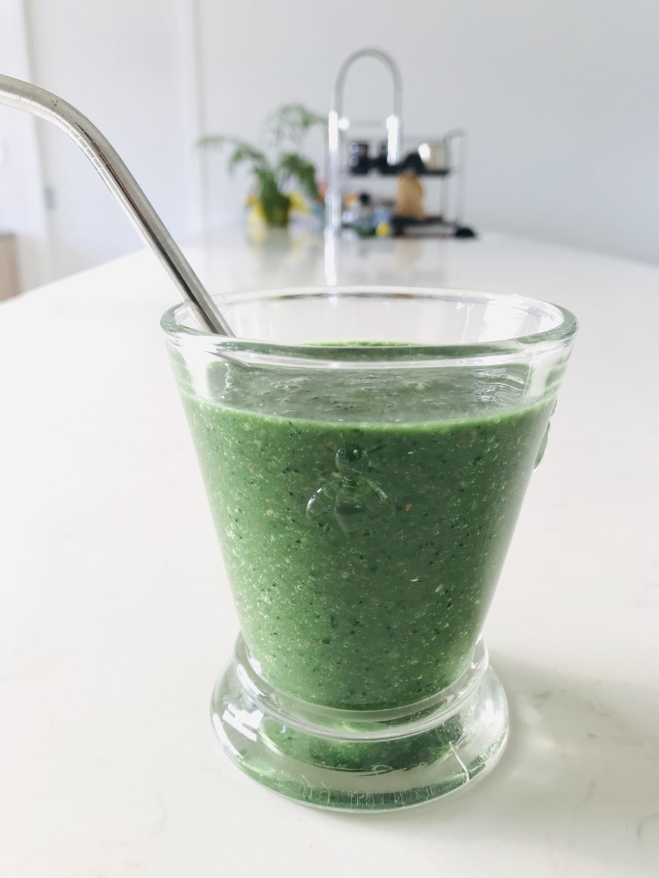 Green spirulina smoothie in a glass