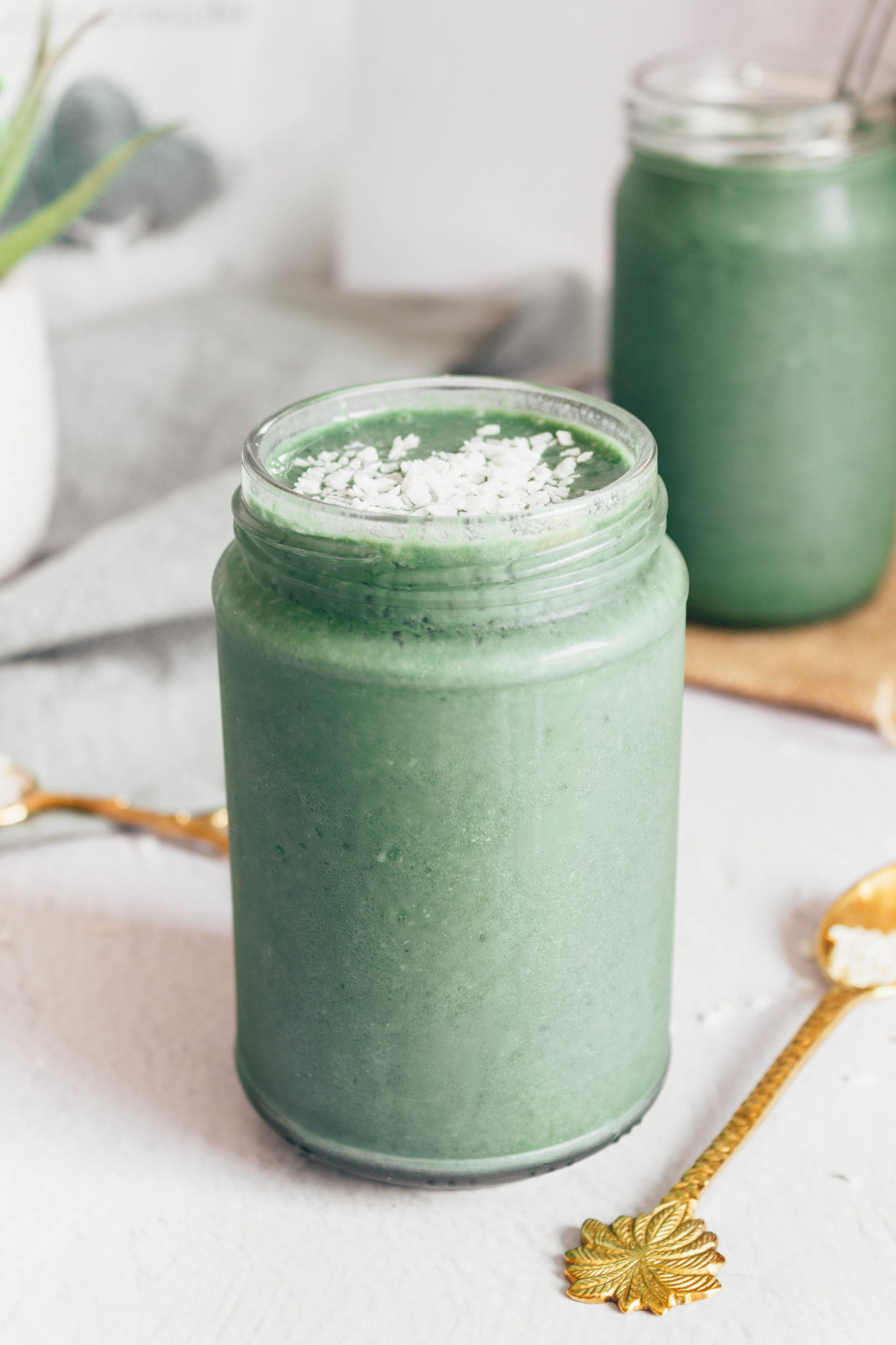 Green spirulina smoothie in a jar